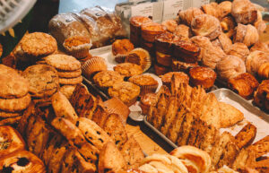 A bakery case full of baked goods.