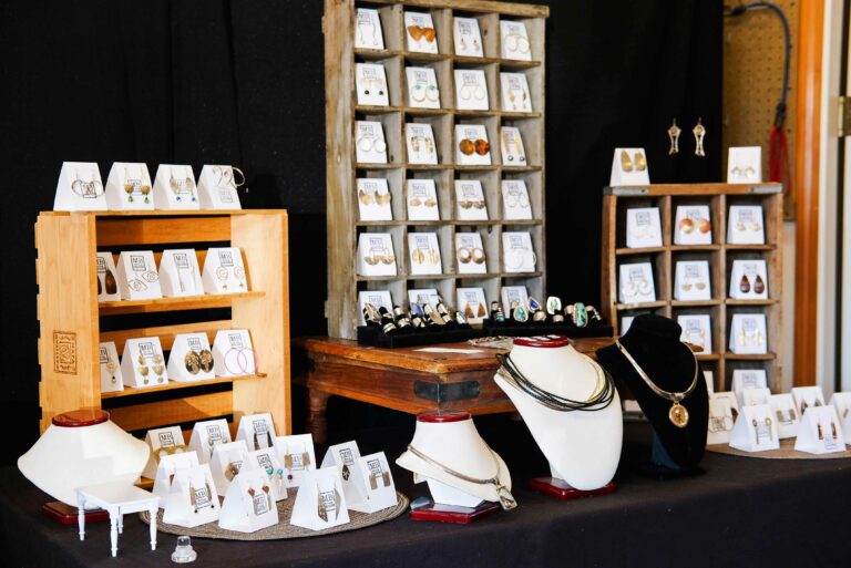 A jewelry display that includes earrings, rings and necklaces.