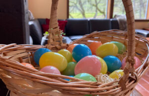 A basket full of colorful plastic easter eggs.