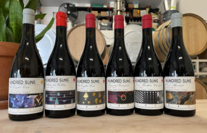 A lineup of wine bottles from Hundred Suns Wine.