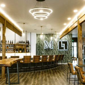 A glamorous bar and tasting room with warm lighting.