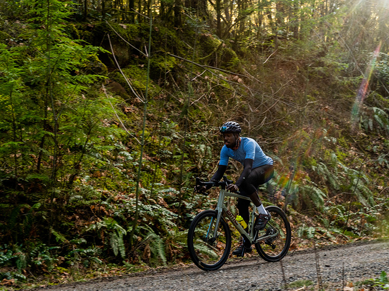 Cyclist riding a bike through the forest